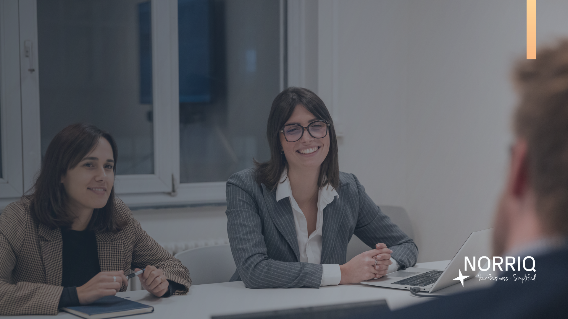 A lawyer in the office reviewing digital invoices on a laptop, symbolizing the transition to Peppol e-invoicing in 2026.