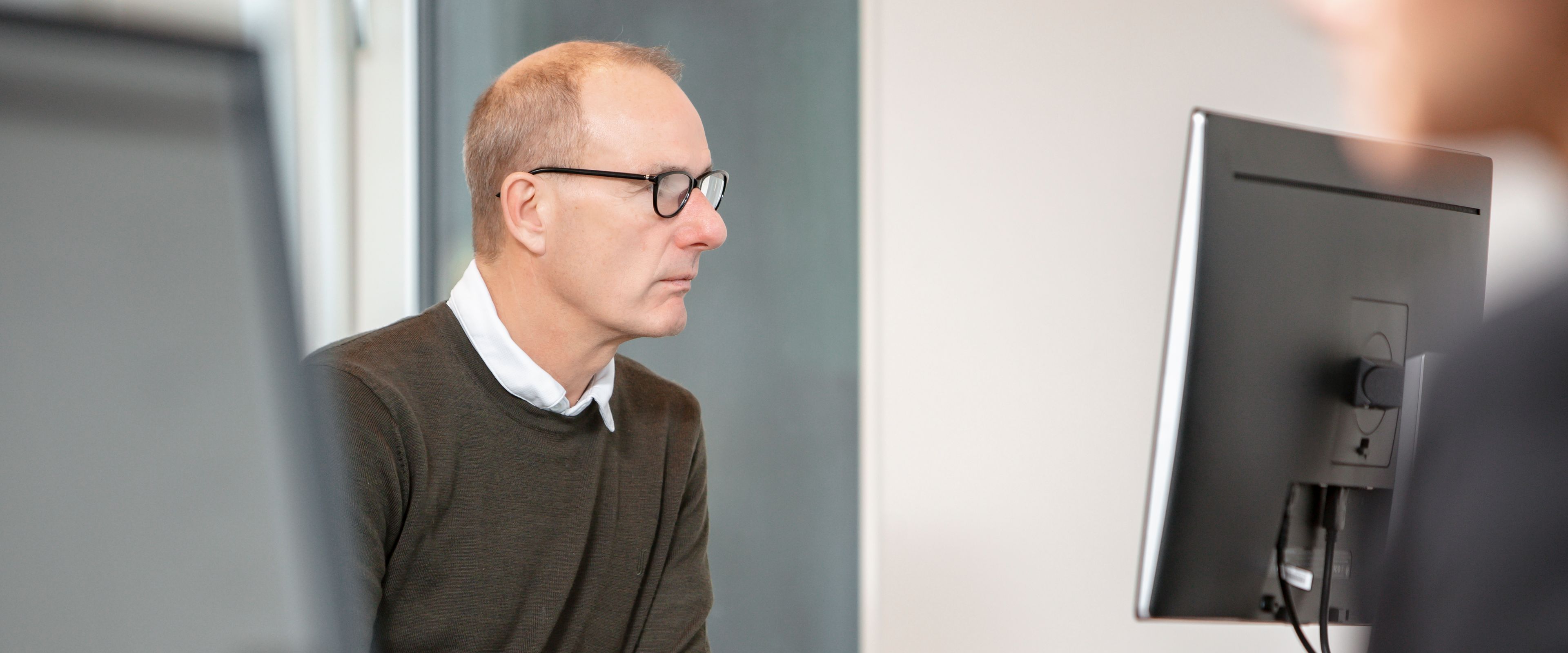 People working on computer screens